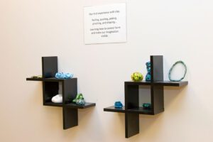 A display of clay artwork done by children at Strong Start