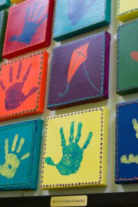 Hand print artwork by children at Strong Start Early Learning Center