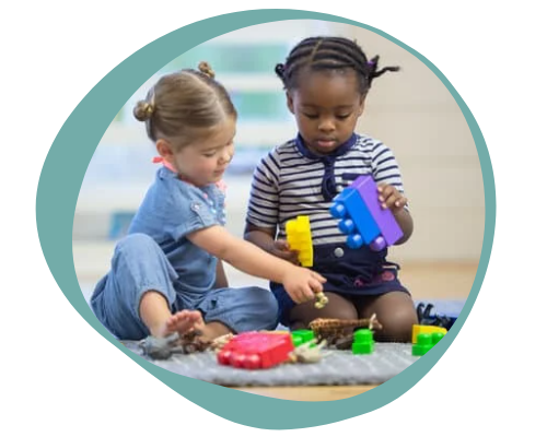 Two children playing with blocks