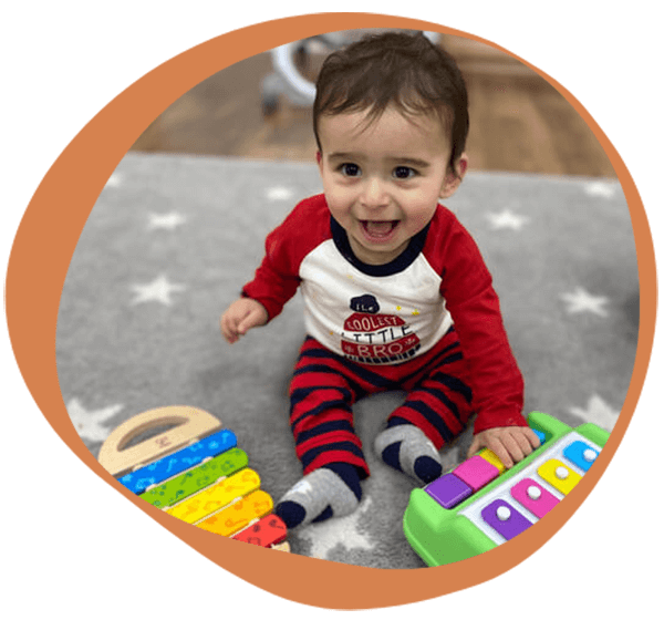 a baby playing with toys at one of our daycare centers