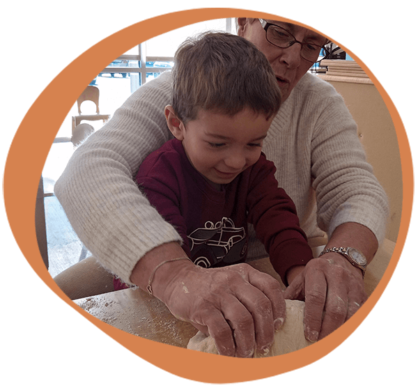 a student and teacher making bread