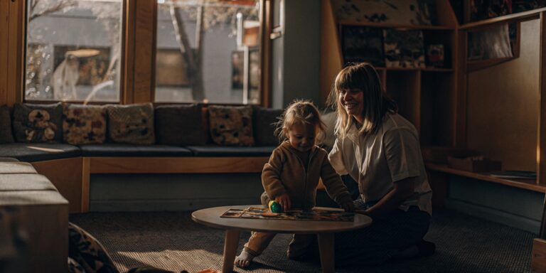 A mother and her child enjoying a learning activity at a private preschool.