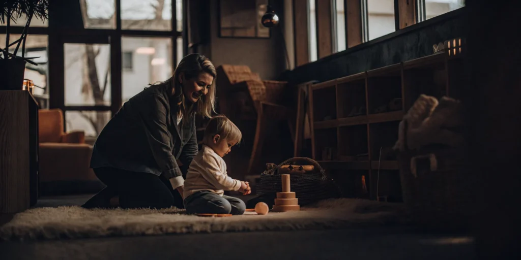 Infant and mother exploring toys during an early learning program in Bridgeport, CT.