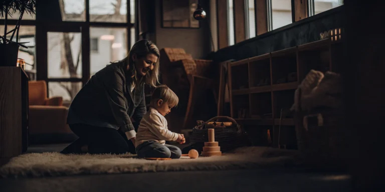 Infant and mother exploring toys during an early learning program in Bridgeport, CT.