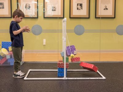 a child working on a STEM activity at one of our daycare centers